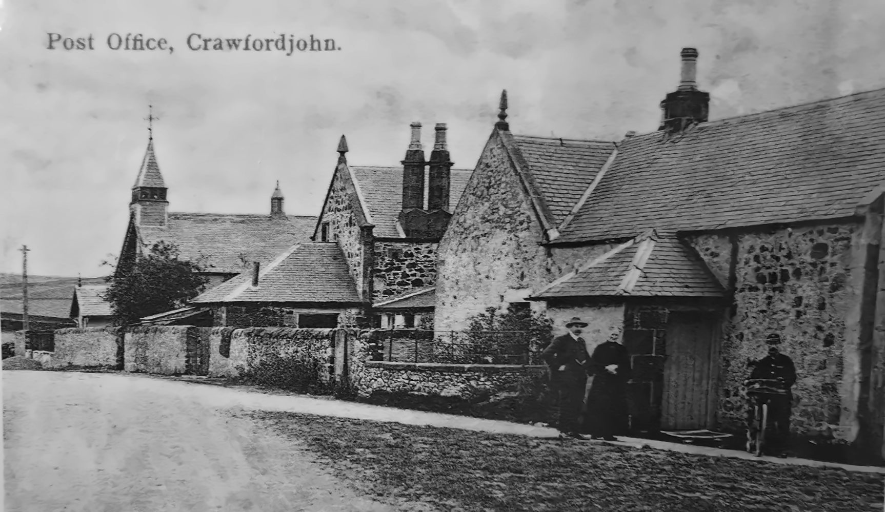 Historic view of Crawfordjohn village showing the old Post Office and surrounding buildings