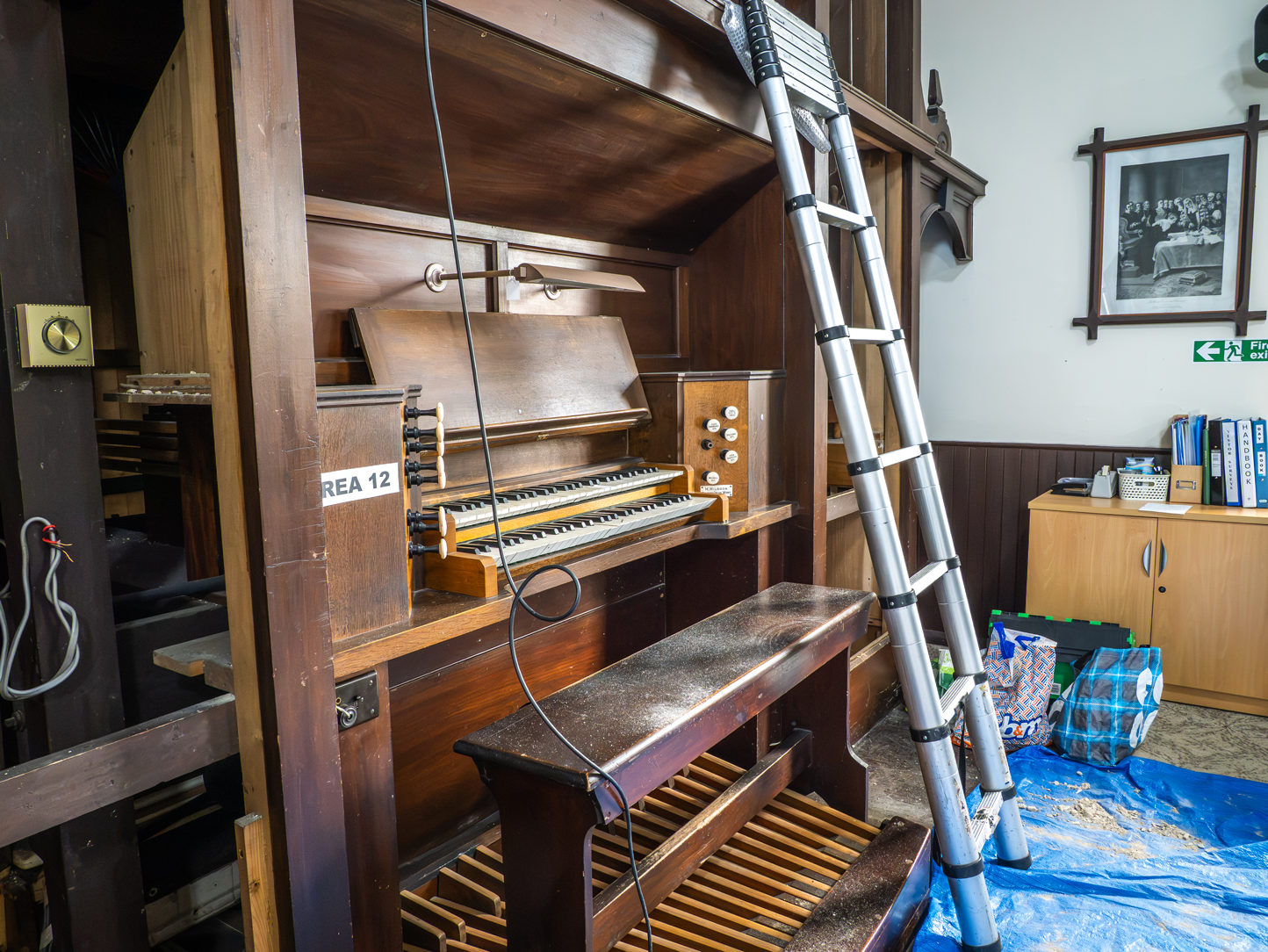 The historic pipe organ console, keyboards and pedalboard during dismantling