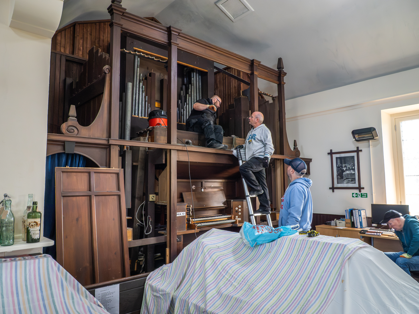 The Crawfordjohn pipe organ being dismantled for removal and restoration